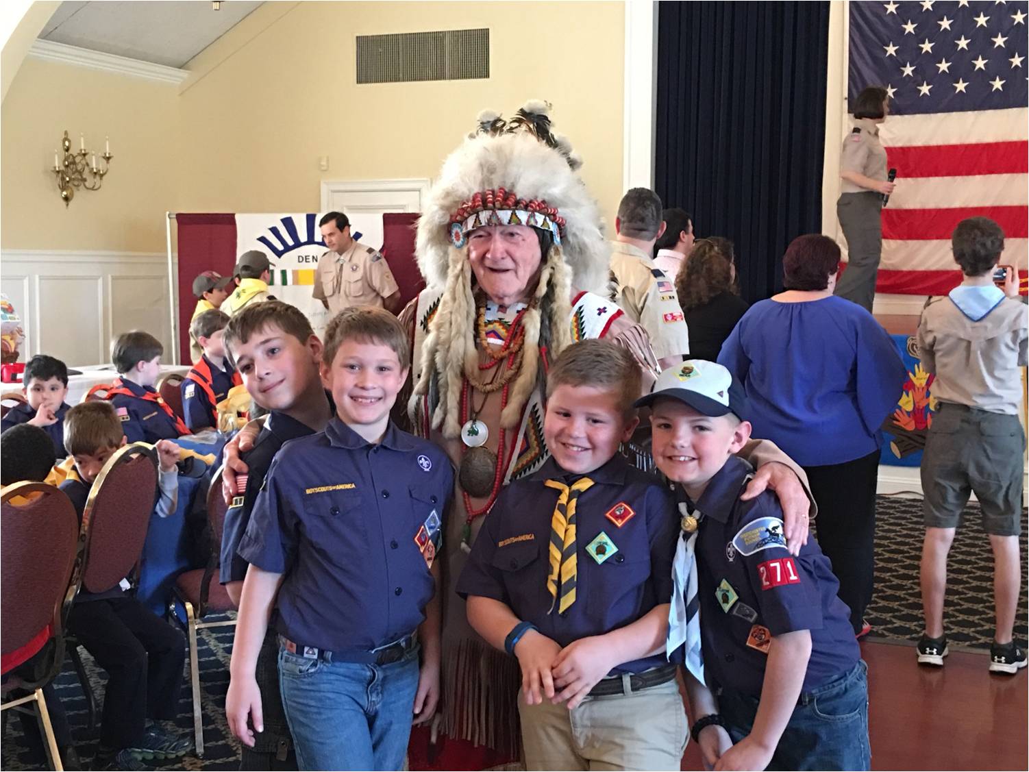 Scouts with Akela at the Blue and Gold Banquet.