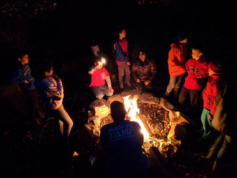 Scouts gathered around the campfire.